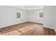 Bedroom with new floors and new ceiling fan, freshly painted in a neutral color at 1124 Hardimont Rd, Raleigh, NC 27609