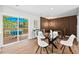 Inviting dining area with sliding glass doors opening to a deck with outdoor seating at 1124 Hardimont Rd, Raleigh, NC 27609
