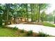 Beautiful brick home with manicured lawn and mature trees giving it a gorgeous curb appeal at 1124 Hardimont Rd, Raleigh, NC 27609