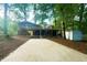 Charming two-story home with a spacious deck, showcasing outdoor living with an inviting entertainment space at 1124 Hardimont Rd, Raleigh, NC 27609