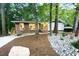 Charming single-story home with lush landscaping and a blue front door at 1124 Hardimont Rd, Raleigh, NC 27609