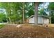 A single Gathering home with brick and light gray wood with a well landscaped yard at 1124 Hardimont Rd, Raleigh, NC 27609