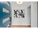 Bright foyer with modern decor, featuring abstract art and stylish blue door at 1124 Hardimont Rd, Raleigh, NC 27609
