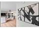 Open-concept design with stylish modern decor and hardwood floors. The art makes a statement at 1124 Hardimont Rd, Raleigh, NC 27609