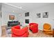 Bright and airy living room with a fireplace, modern seating, and stylish decor, perfect for relaxation and entertainment at 1124 Hardimont Rd, Raleigh, NC 27609