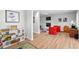 Spacious playroom with a cozy fireplace and comfortable seating, creating a fun and relaxing environment at 1124 Hardimont Rd, Raleigh, NC 27609