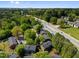 Overhead angle of townhomes bordering green spaces and highways at 115 Coleridge Ct, Carrboro, NC 27510
