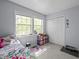 Bright bedroom with two windows and ample storage; a perfect, cozy space at 115 Coleridge Ct, Carrboro, NC 27510