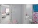 Hallway leads to a bathroom with a heart-themed shower curtain and a view into the bedroom at 115 Coleridge Ct, Carrboro, NC 27510