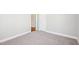 Cozy bedroom with neutral carpet, light gray walls and white door frames at 115 Higbee St, Durham, NC 27704