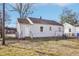 Back of the house with a covered carport and a swing set at 115 Higbee St, Durham, NC 27704