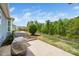 Outdoor patio with seating area and scenic views of the wooded backyard, ideal for relaxation at 1208 Steinbeck Dr, Durham, NC 27703