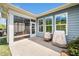 Covered patio featuring access to screened-in porch, offering views of the backyard at 1208 Steinbeck Dr, Durham, NC 27703