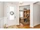 Inviting foyer leading to a home office with custom built-in bookshelves and hardwood floors at 1208 Steinbeck Dr, Durham, NC 27703
