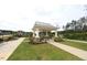 Beautiful gazebo, with a ceiling fan and seating, nestled in a landscaped area for relaxation and enjoyment at 1208 Steinbeck Dr, Durham, NC 27703