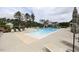 Community pool offers a spacious sun deck, lounge chairs, and shaded seating areas, perfect for recreation at 1208 Steinbeck Dr, Durham, NC 27703