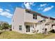 The home's back exterior features an outdoor seating area and well-maintained lawn perfect for relaxing at 1304 Cozart St # 216, Durham, NC 27704
