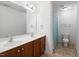 Bathroom featuring a double vanity, toilet, and shower at 1304 Cozart St # 216, Durham, NC 27704
