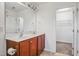 Bathroom featuring double sinks with vanity and walk-in closet at 1304 Cozart St # 216, Durham, NC 27704