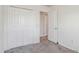 This bedroom has a closet and two doors at 1304 Cozart St # 216, Durham, NC 27704