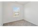 This bedroom has a window and carpeted floors at 1304 Cozart St # 216, Durham, NC 27704