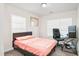 Bedroom with a bed, a desk and 2 windows at 1304 Cozart St # 216, Durham, NC 27704