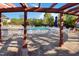 Enjoy community amenities at this pool with plenty of lounge chairs, tables, and manicured greenery at 1304 Cozart St # 216, Durham, NC 27704
