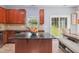 Modern kitchen features dark granite countertops, stainless steel appliances, and ample natural light at 1304 Cozart St # 216, Durham, NC 27704