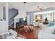 Cozy living room with hardwood floors, fireplace, stairs, and a view into the adjacent kitchen at 1304 Cozart St # 216, Durham, NC 27704