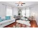 Bright living room with hardwood floors, neutral decor, piano, and an open layout at 1304 Cozart St # 216, Durham, NC 27704