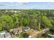 Aerial view of a home with a large backyard, surrounded by mature trees and a lush green landscape at 1310 Mayfair Rd, Raleigh, NC 27608