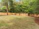 This expansive backyard has a new wooden fence and is ready for outdoor games and activities at 1310 Mayfair Rd, Raleigh, NC 27608