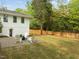Backyard features new sod, gravel firepit, and charming white Adirondack chairs - perfect for outdoor relaxation at 1310 Mayfair Rd, Raleigh, NC 27608