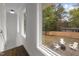 Cozy backyard area with white Adirondack chairs and a fire pit, perfect for outdoor entertaining at 1310 Mayfair Rd, Raleigh, NC 27608