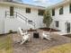 Inviting backyard with a cozy fire pit area, perfect for gatherings and relaxation at 1310 Mayfair Rd, Raleigh, NC 27608