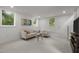 Bright basement featuring modern decor, a cozy seating area, and an entertainment unit at 1310 Mayfair Rd, Raleigh, NC 27608