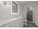Modern bathroom with sleek vanity, stylish fixtures, and a walk-in shower with mosaic tile at 1310 Mayfair Rd, Raleigh, NC 27608