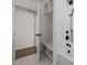 Modern bathroom features a soaking tub, sleek white tile, and matte black fixtures at 1310 Mayfair Rd, Raleigh, NC 27608