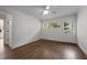 Bright and airy bedroom featuring hardwood floors and lovely natural light at 1310 Mayfair Rd, Raleigh, NC 27608