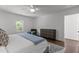 Bright bedroom featuring hardwood floors, ceiling fan, and a lovely window view at 1310 Mayfair Rd, Raleigh, NC 27608
