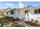 Charming white brick home featuring a classic front porch, landscaped garden, and inviting entrance at 1310 Mayfair Rd, Raleigh, NC 27608