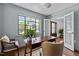 Cozy home office with natural light, built-in bookshelves, and a comfortable workspace at 1310 Mayfair Rd, Raleigh, NC 27608