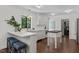 Bright kitchen features white cabinetry, stainless steel appliances, and breakfast bar seating at 1310 Mayfair Rd, Raleigh, NC 27608