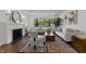 Stylish living room featuring a modern fireplace, zebra-print rug, and abundant natural light at 1310 Mayfair Rd, Raleigh, NC 27608