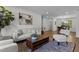 Comfortable living room with neutral tones, hardwood floors, and stylish zebra print rug at 1310 Mayfair Rd, Raleigh, NC 27608