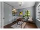 Comfortable office with custom built-ins, hardwood floors, and soft natural light at 1310 Mayfair Rd, Raleigh, NC 27608