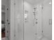Contemporary shower featuring white subway tile, glass enclosure, and modern fixtures at 1310 Mayfair Rd, Raleigh, NC 27608