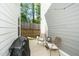 Cozy backyard patio perfect for relaxation, featuring seating area and grill at 1403 Chipping Dr, Apex, NC 27502