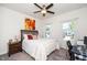 Bright bedroom featuring two windows and a dark wood desk at 1403 Chipping Dr, Apex, NC 27502