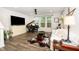 Cozy living room with lots of natural light and entertainment center at 1403 Chipping Dr, Apex, NC 27502